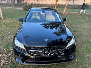 Mercedes-Benz C180 avantgrade-S  package ( twin turbo charged)
Model 2019 ( original facelift)
Registered Islamabad 2020
Shahnawaz import 
Mileage 13000
Brand New condition ( bumper to bumper original & spotless)
Full service history in shahnawaz Lahore. Only one moter oil changed.
Colour Black with beige nappa leather interior.
Top of line specs.
Electric Panoramic sunroof 
Premium entertainment sound system 
Electric power seats 
8 zone climate control air conditioning 
54 colours ambient interior lighting 
Adapted cruise control 
360 degrees cameras
Auto Parktronic access 
Multi drivetonic sensors
Multiple driving selection 
LED adapter headlights 
Apple CarPlay & android apps 
Crome line  packages 
18” alloy wheels 
Privacy glass 
Further information please call & visit Victory Cars jail road Lahore.
National wide delivery available.