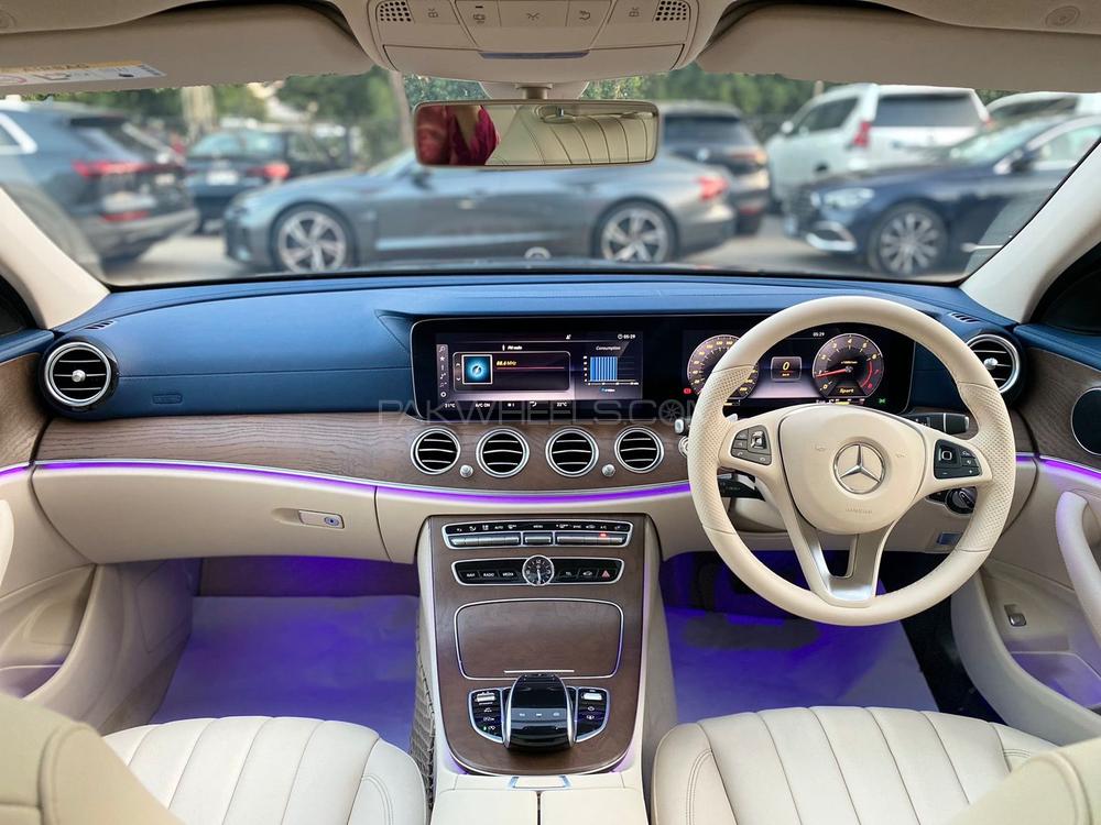 Mercedes E200 Exclusive 
Model: 2018
Mileage: 5,500 Km
Reg: 2018 Khi

*Blue dashboard  
*Panoramic glass sunroof
*Ambient lighting 
*Digital instrument cluster
*Customised steering wheel on order from Shahnawaz 
*Shahnawaz import and maintained

Calling and Visiting Hours. 

Monday to Saturday

11:00 AM to 7:00 PM