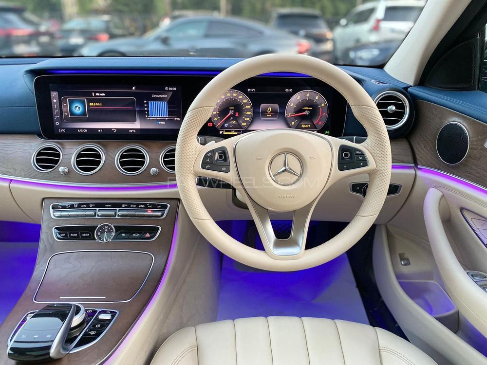 Mercedes E200 Exclusive 
Model: 2018
Mileage: 5,500 Km
Reg: 2018 Khi

*Blue dashboard  
*Panoramic glass sunroof
*Ambient lighting 
*Digital instrument cluster
*Customised steering wheel on order from Shahnawaz 
*Shahnawaz import and maintained

Calling and Visiting Hours. 

Monday to Saturday

11:00 AM to 7:00 PM