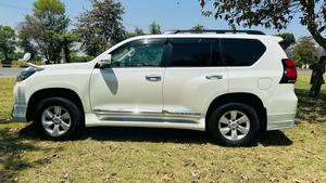 Toyota LandCruiser Prado 2700cc txl 
Model 2019 fresh import 2024 
Un-registered 
Pearl white metallic with beige leather interior 
Bumper to Bumper original condition ( spotless) 
7 seater with sunroof 
Multi power nappa leather electric seats 
Heated & cooling ( ventilated ) seats 
Cool box 
Multi zone duel climate control system 
B&o entertainment sound system
Multi cameras 
Adapted Radar 
Active line accessed 
Adapted cruise control 
Auto parking accessible 
All zone parktronic sensors 
Full  glossy wooden interior 
Full trd sport body kit 
Crome package 
Further information please contact & visit Victory Cars jail road Lahore