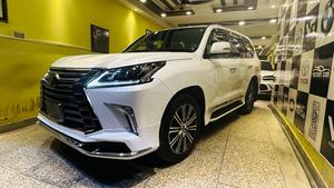 Lexus LX570 (ultra sports utility package)
Model 2019 fresh import 2025
Unregistered 
Diamond White metallic with orinzo bronze nappa leather interior 
Brand new condition ( spotless )
Mileage 22000 km 
Auction grade 5 AA
Top of the line specs ( full house )
Original body kitted 
Further information please call & visit at Victory Cars jail road Lahore.