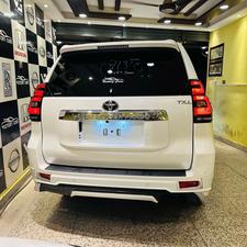 Toyota LandCruiser Prado TX-L 
Mode 2019 fresh import ( unregistered)
Mileage 33000 km
Pearl white with beige leather interior 
Brand new condition ( spotless)
Auction grade 4.5
7 seater with sunroof 
Top of line specs.
Nappa leather multi power seats with heated & ventilated ( air conditioning)
B/o premium entertainment sound system.
Multi cameras 
Customised fitting 
Crome package 
8 zone climate control air conditioning system 
Adapted active Radar 
Line accessed 
Adapted cruise control system 
All zone parktronic sensors 
Full body kit
18” alloy wheels with new tyres.
Further information please call & visit at Victory Cars jail road Lahore.