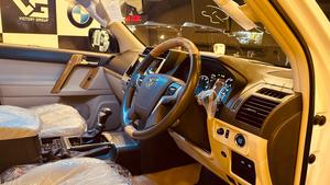 Toyota LandCruiser Prado TX-L 
Mode 2019 fresh import ( unregistered)
Mileage 33000 km
Pearl white with beige leather interior 
Brand new condition ( spotless)
Auction grade 4.5
7 seater with sunroof 
Top of line specs.
Nappa leather multi power seats with heated & ventilated ( air conditioning)
B/o premium entertainment sound system.
Multi cameras 
Customised fitting 
Crome package 
8 zone climate control air conditioning system 
Adapted active Radar 
Line accessed 
Adapted cruise control system 
All zone parktronic sensors 
Full body kit
18” alloy wheels with new tyres.
Further information please call & visit at Victory Cars jail road Lahore.