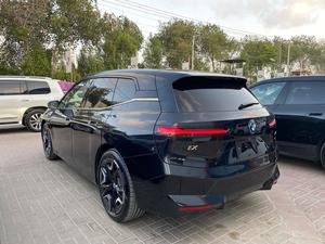 BMW iX Xdrive 50
Model: 2023
Mileage: 3,800 km
Un-Registered 
Japan Import

One & Only with 
530 Hp & 550 km Range

Black sapphire Metallic Colour 
with Tan Interior

*Wireless Apple carplay and android auto
*LED headlights 
*Ambient lights
*Four-zone climate control
*Comfort Access keyless entry 
*Bowers and wilkins sound System
*14.9-inch touchscreen infotainment system
*Active steering
*Soft closing doors
*BMW Natural Interaction voice assistant
*22-inch alloy wheels
*Front massage seats
*Panoramic glass roof sky lounge with electrochromatic shade function

Calling and Visiting Hours

Monday to Saturday

11:00 AM to 7:00 PM