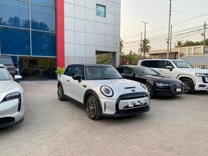 Mini Cooper S LEVEL 3
Model: 2022
Mileage: 7,900 km 
Exterior: White Silver metallic 
with Black Roof
Interior: White/ Ivory 
Unregistered 

*Harman Kardon Sound
*Panoramic Sunroof
*"17" Alloy Wheels Roulette style
*8.8in Touchscreen with LED Ring
*Apple Carplay
*LED Headlights with Closed Ring as Daytime Driving Lights
*Navigation Plus Pack
*AC-DC Charging
*Two Zone Climate Control
*Ambient Lighting
*Driving Assist Pack
*Dynamic Stability Control - DSC
*Interior Trim - Piano Black
*Heated & ventilated Seats

Calling and Visiting Hours

Monday to Saturday

11:00 AM to 7:00 PM