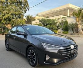 HYUNDAI ELANTRA GLS TOP OF THE LINE NEW RIMS (2000cc)
Model 2021 December || Registered 2022
Only 25,300 KM 100% Genuine 
Hyundai South Maintained 
Cyber Grey Color 
Bumper to bumper original guaranteed 100 %
TOP OF THE LINE
Original NEW TV Back Cam
Original NEW Leather Seats
Original NEW RIMS
Sunroof 
Wireless Charger
Dual Power Seats
Spare Wheel Unused 
Fog lights
Just Like Zero Meter 
All seals still intact 
See to Believe 
Ready Delivery 
EXCHANGE POSSIBLE WITH ANY CAR

For inspection
Available at SUPREME CARS
Plot # 151/F,Under Imam heights,Shop no.1&2, Main Khalid Bin Walid Rd, Karachi, Sindh 75400

|  Premium Cars  |  Best Prices  |  Optimum Performance | 
#supremecarsgang