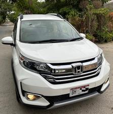 HONDA BRV S PACKAGE TOP OF THE LINE NEW SHAPE PUSH START LIMITED EDITION(1500cc)
Model 2020 || Registered 2020
Only Genuine 28,000 KM
Taffeta White Color
Bumper to Bumper Original 100%
Guaranteed 
Scratch-less Spotless  
Push start
Centre console/ Hand-rest
Automatic Transmission
Original TV NAV
Climate Control
New Grill 
Original Fog Lights
Genuine Rims
Just like Zero Meter
All Seals Still Intact 
EXCHANGE POSSIBLE WITH ANY CAR

For inspection
Available at SUPREME CARS
Plot # 151/F,Under Imam heights,Shop no.1&2, Main Khalid Bin Walid Rd, Karachi, Sindh 75400

|  Premium Cars  |  Best Prices  |  Optimum Performance | 
#supremecarsgang