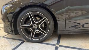 Mercedes-Benz CLA200  AMG -S ( twin turbocharged ) night black package 
Model 2021 registered 2022 in Islamabad 
Shahnawaz import.
Pearl black metallic with twin shadesd Dezine line AMG leather interior 
Mileage 24000 km
Bumper to Bumper original & spotless condition 
Top of line customised specs. 
Memory package, 14 electric power seats ejectment , heated & ventilated seats 
AMG spot bucket seat 
Multi zone climate control air conditioning 
Burmaster pro. surround sound entertainment system 
Panoramic electric sunroof 
Head up display 
Multi massager seats package 
Telescopic electric steering wheel 
Paddle shifter 
Adapted cruise controls 
Radar & adapted line accessed 
360 degrees cameras 
Multi zone auto parktronic package 
64 colours ambient lights interior 
Perfume package 
Multi driving modes eco, individual, sport, sport + & comfort.
Privacy glass package 
AMG sport suspension 
Wireless charger 
Wireless Apply CarPlay & android apps 
AMG muffler with change sound 
19 “ AMG sport alloy wheels 
Full AMG body kitted 
GT line front grill
Flat screen o led smart cluster 
Adapted led laser headlights 
Further information please call & visit at Victory Cars jail road Lahore.