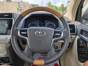 Fresh Import 2025
TX L Package
Wooden Steering 
New Transmission 
(Leather Electric Heating & Cooling Seats)
Colour: Pearl White
2020 Model
Low Mileage: 20268 KM
Beige Interior
7 Seats
19 Inches Original Alloy Rims
Sunroof
Toyota Genuine Navigation System
Toyota Genuine TV
Toyota Genuine Back Camera
No.1 Japan Quality
5 AA Auction Grade And Genuine Verifiable Auction Sheet
Auction Sheet Attach For Satisfaction And Verification
Modelista Genuine Body Kit (Front & Back)
Genuine New Model
Genuine New Interior
Prado Super Live Sound System
14 Speaker
Shiny Pearl White Color
Intelligent Entertainment
Digital TV
Led Head Lamp
100% Original
4WD,ETC
Multi-Function Steering Controls
Fog Lamps
Genuine New Front Grill
Steering Gear Type: Rack & Pinion Type With Power Assist
Retractable Side Mirrors With Indicators
All Windows Full Automatic (One Touch Up/down)
Immobilizer (Anti-theft)
Digital Climate Control A/c & Heater
Rain Visors
8 Airbags