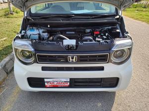 Fresh Import 2025 
L Led Package
Model: 2023
Low Mileage: 24108 KM
Shiny Pearl White Colour
Leather steering Wheel 
Remote Keyless Entry
No.1 Japan Quality
Custom Edition
Adaptive Cruise Control
Push Start Engine
Fully Automatic Air Conditioner
Navigation System
Back Camera
Led Headlights
Auto Brake Hold Function
Heated Seats
Engine In Clean & Good Condition
No.1 Japan Quality
All Power Windows
Led Sequential Turn Signal Lamps (Front) &
Full Led Rear Combination Lamps
Eco Idle Technology
Runs & Drives Great
Clean Interior & Exterior
Power Steering
Rear Wiper
Immobilizer
Sofa Seats
Winker Mirror
Retract Mirrors
According To Honda Motor Corporation Japan 29.4 Km/l
Glass With Ultra-violet Filter
Steering: Power Assist Equipped Rack & Pinion
8 SRS Air Bag
Traction Control
High Quality Luxury Hatchback
Brand New Tyres
Anti-lock Brakes
Passenger Airbag
Fully Loaded