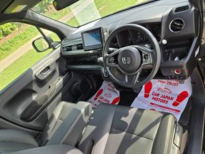 Fresh Import 2025 
Custom Package
Model: 2023
Low Mileage: 46093 KM
Shiny Pearl Black Colour
14 Inch Alloy Wheels  
Leather steering Wheel 
Remote Keyless Entry
No.1 Japan Quality
Custom Edition
Adaptive Cruise Control
Push Start Engine
Fully Automatic Air Conditioner
Navigation System
Back Camera
Led Headlights
Auto Brake Hold Function
Heated Seats
Engine In Clean & Good Condition
No.1 Japan Quality
All Power Windows
Led Sequential Turn Signal Lamps (Front) &
Full Led Rear Combination Lamps
Eco Idle Technology
Runs & Drives Great
Clean Interior & Exterior
Power Steering
Rear Wiper
Immobilizer
Sofa Seats
Winker Mirror
Retract Mirrors
According To Honda Motor Corporation Japan 29.4 Km/l
Glass With Ultra-violet Filter
Steering: Power Assist Equipped Rack & Pinion
8 SRS Air Bag
Traction Control
High Quality Luxury Hatchback
Brand New Tyres
Anti-lock Brakes
Passenger Airbag
Fully Loaded