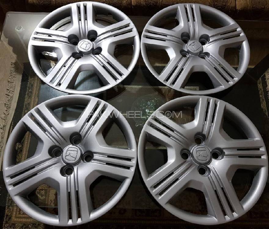 honda city orignal tyres and rim with covers Image-1