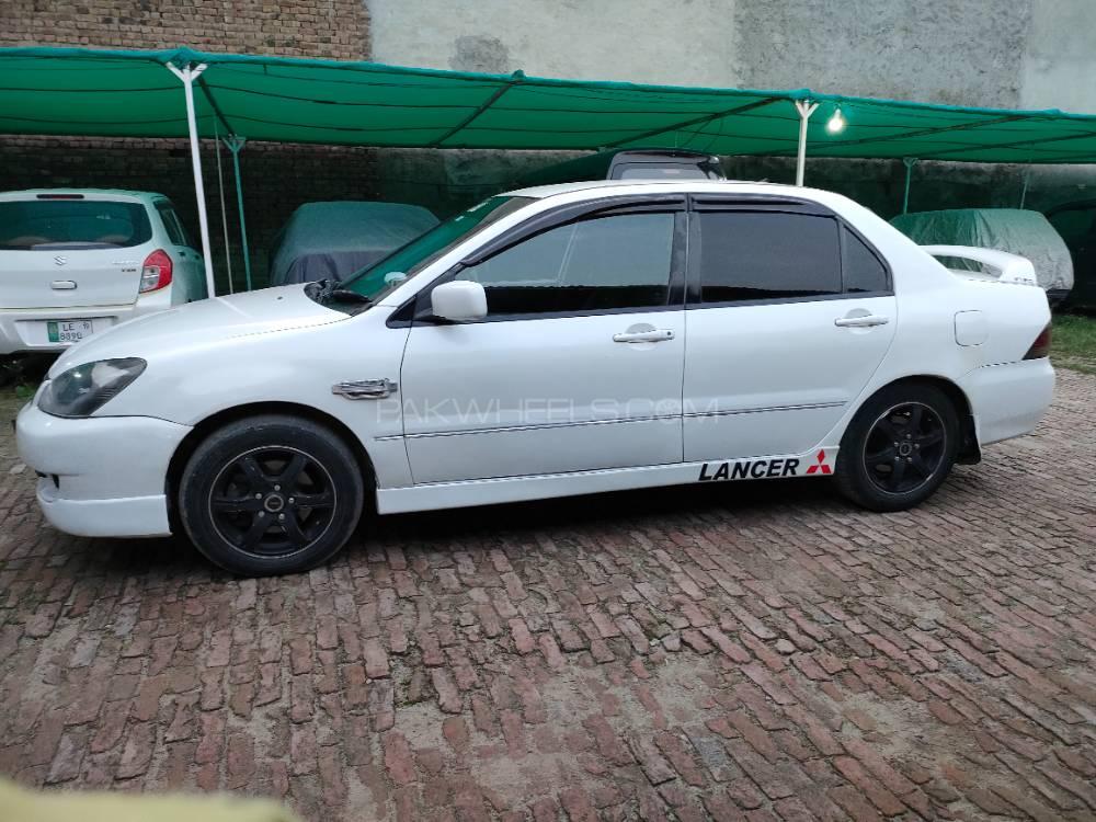 مٹسوبیشی لینسر - 2004  مٹسوبیشی لینسر - 2004  Image-3