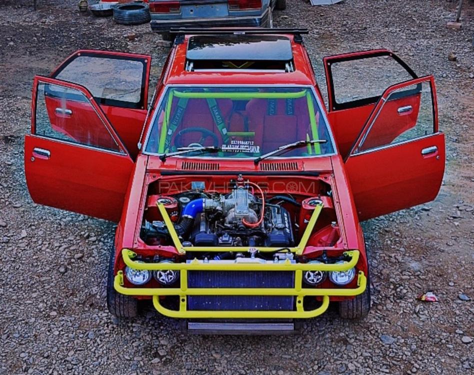 Mazda 323 - 1980 Orange Inferno Image-1