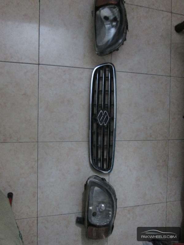 Suzuki Baleno 2002 to 2004 Front Grill and 1 Pair Of Headlig Image-1