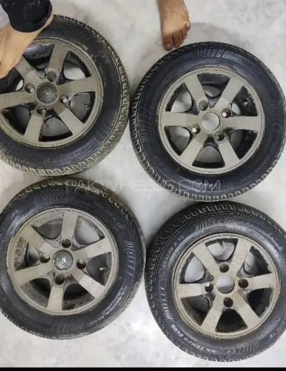 Selling 4 Alloy rims with Tyres
12 inches size and 1 stepany Image-1